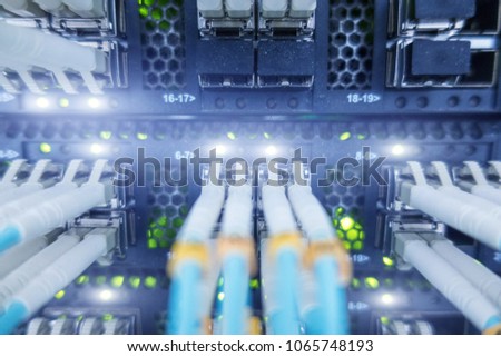 Racks optical fiber. Fiber optic equipment in a data center. Close up fiber optic cable. 