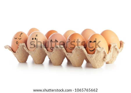 Chicken eggs with funny emoticons isolated on white background