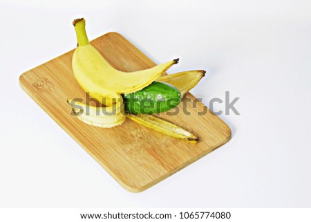A cucumber in the peel of a banana