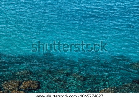 Aerial view on clear, transparent  turquoise water of Mediterranean Sea on Cyprus island, natural water background or pattern