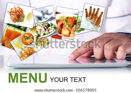 Chef is using a digital tablet, With a pictures Food items