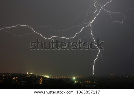 Powerful bright lightning in the night sky
