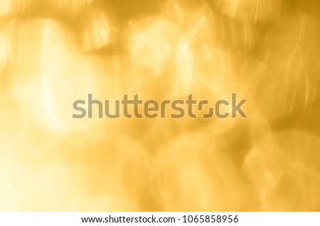 Abstract light gold background. Shiny golden pattern for Christmas design.