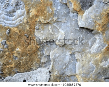 Granite texture with yellow shades, stone pattern with granite, cracked surface, abstract background for the designer, blank for the designer, vintage style