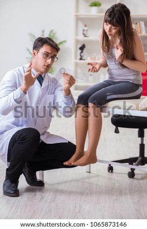 Doctor checking patients joint flexibility