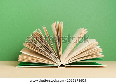 Open book on wooden table. Education background. Back to school.
