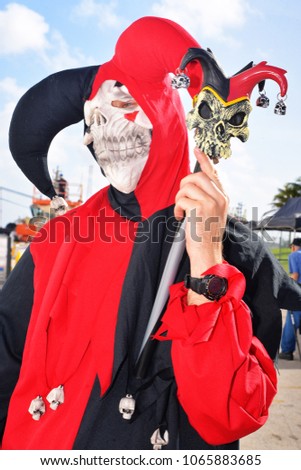 young man in Mardi gras skeleton costume