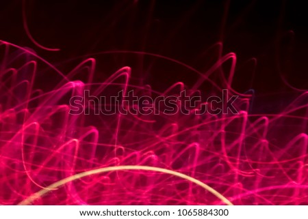 Abstract background of pink neon glowing light shapes. Bright red stripes  Can use for poster, website, brochure, print. 