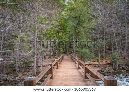 footbridge over river at yosemite 
