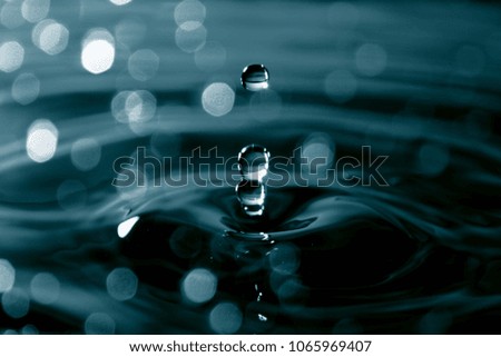 Water droplet as background / Water is a transparent, tasteless, odorless, and nearly colorless chemical substance that is the main constituent of Earth's streams