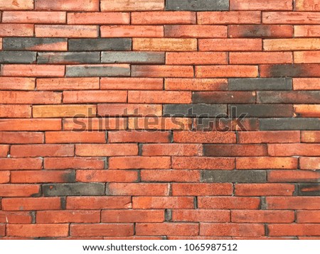 Black and brown brick wall background texture