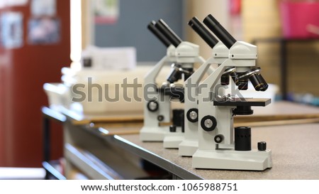 electronic microscope series arrangement of microscopes in the science classroom lab laboratory museum. science biology pathology chemistry forensic medical research student school university concept