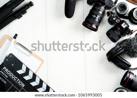 Cinema minimal concept. Watching film in the cinema. clapper board on yellow background. Screenwrite desktop Royalty-Free Stock Photo #1065993005