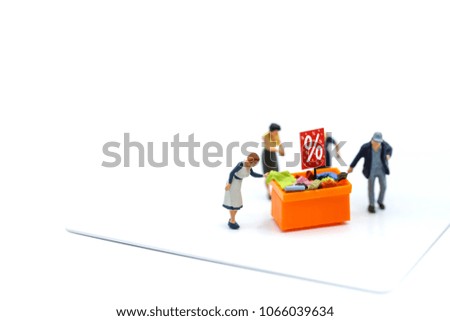 Miniature people : with discount for shopping items,Business and shopping concept.