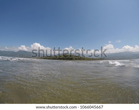 Picture taken from the water with a waterproof camera on the hilly horizon of Costa Rica