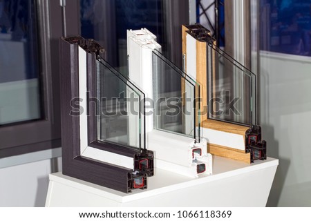 profile of a plastic window, a section of a multi-compartment double-glazed window close-up Royalty-Free Stock Photo #1066118369