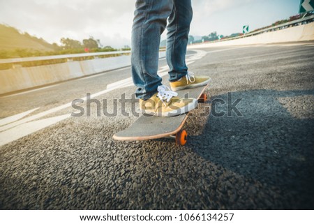 Skateboarder skateboarding  on city street