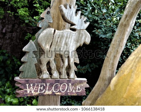 Moose, Wooden Garden Decoration Hanging in a Tree, Sacramento, California USA.