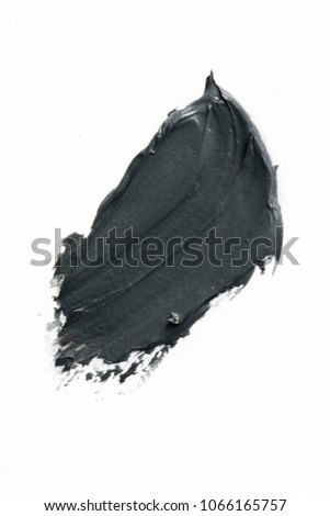 
Clay or charcoal face mask stroke isolated on white
