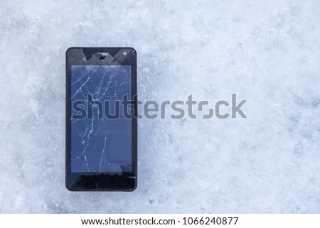 broken smartphone on ice