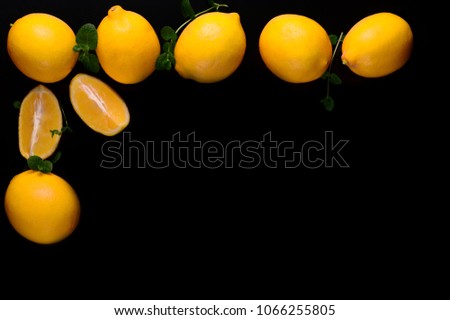 Lemons isolated on the black background. Top view.