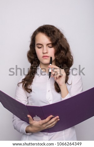 Portrait of a business woman holding folder , Isolated on white background