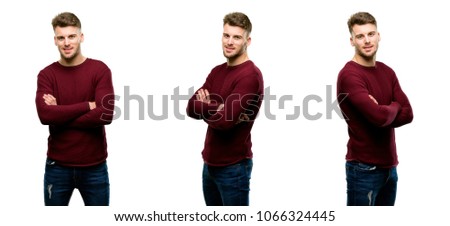 Handsome blond man with crossed arms confident and happy with a big natural smile laughing isolated over white background