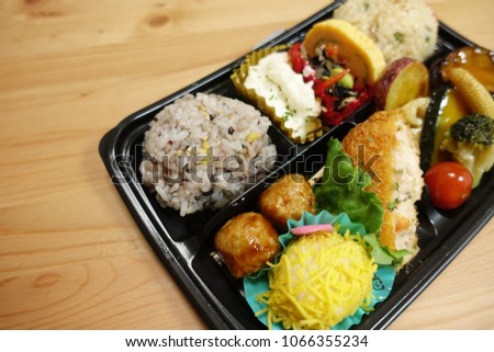 Japanese style obento (rice plate) with varieties of dishes.