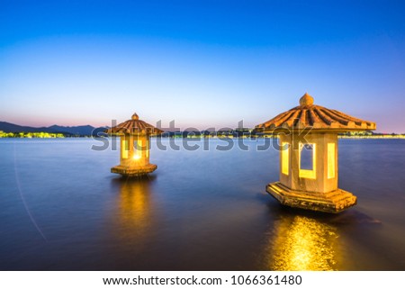 jixian pavilion in hangzhou west lake during sunset,the chinese word in photo means"jixian pavilion"