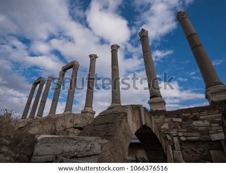 A perspective shot of a series of ruined columns of Smyrna's ancient agora in Izmir Agora, Turkey