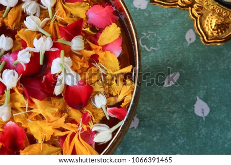 Songkarn Thailand festival jasmine rose and marigold in water freshness petal colorful flowers in bowl background