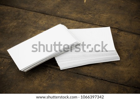 Business card on a wooden background presentation for promotion of Corporate identity.