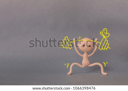 A toy man with copy space. Presentation PowerPoint or Keynote. Motivational phrase. A sketch is drawn on top of the photo.Man holding a barbell with butterfly. Overcoming difficulties