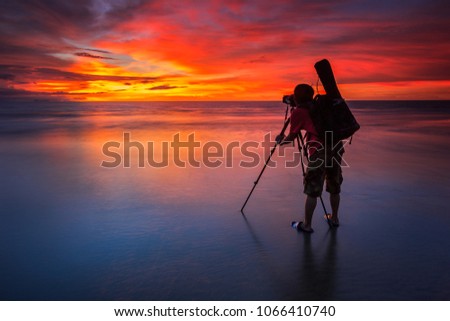 silhouette of photographer during capturing golden hour at sarawak malaysia