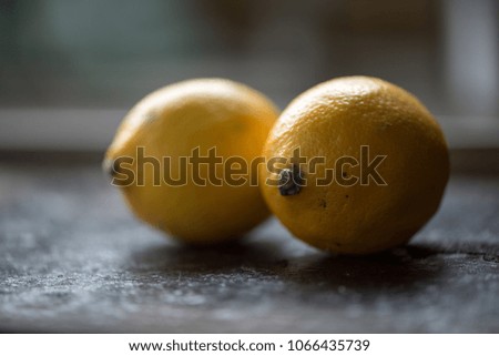 two lemons dark surface