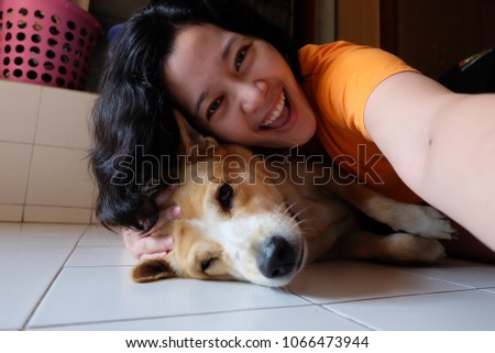 Selfie Asian woman with dog