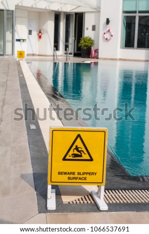 Beware supperty surface sign at swimming pool