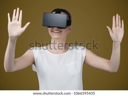 Woman in virtual reality headset against light brown background