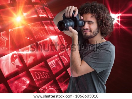 Photographer taking a picture in front of a photo montage frame