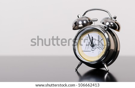 alarm clock as euro symbol at high time