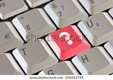 Computer keyboard with red question key - business concept