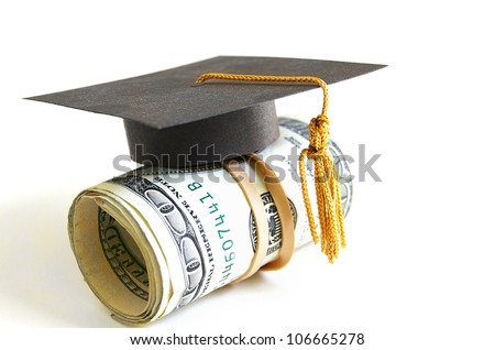 mini graduation cap on a roll of money Royalty-Free Stock Photo #106665278