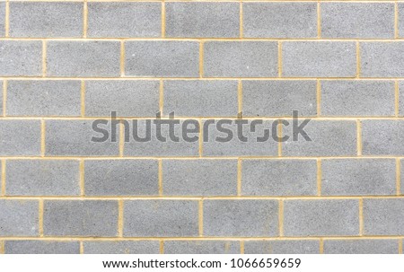 Section of breeze block wall background Royalty-Free Stock Photo #1066659659