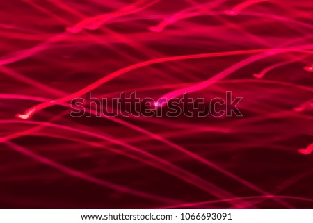 Abstract background of red neon glowing light shapes. Bright stripes  Can use for poster, website, brochure, print. Valentines day template