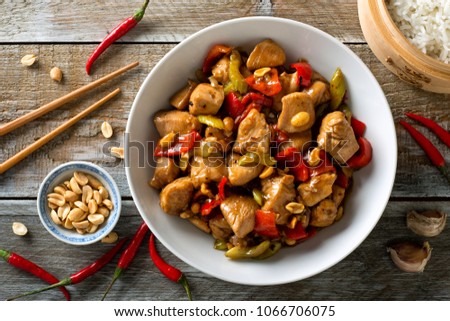 Delicious Kung Pao Chicken with peppers, celery and peanuts. Royalty-Free Stock Photo #1066706075
