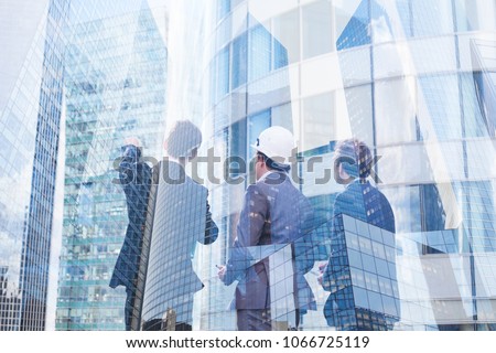 group of business people discussing real estate project, construction of new building, cooperation of architect, designer and manager Royalty-Free Stock Photo #1066725119