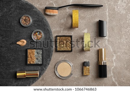 Flat lay composition with cosmetic products on grey background