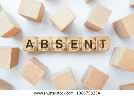 ABSENT word on wooden cubes