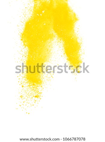Abstract yellow powder explosion on white background.