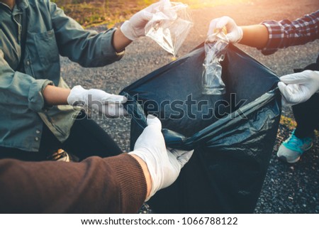 Women volunteer help garbage collection charity environment. Royalty-Free Stock Photo #1066788122